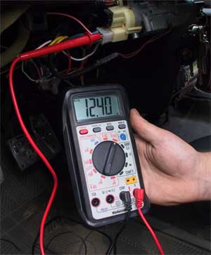 multimeter showing 12 volts